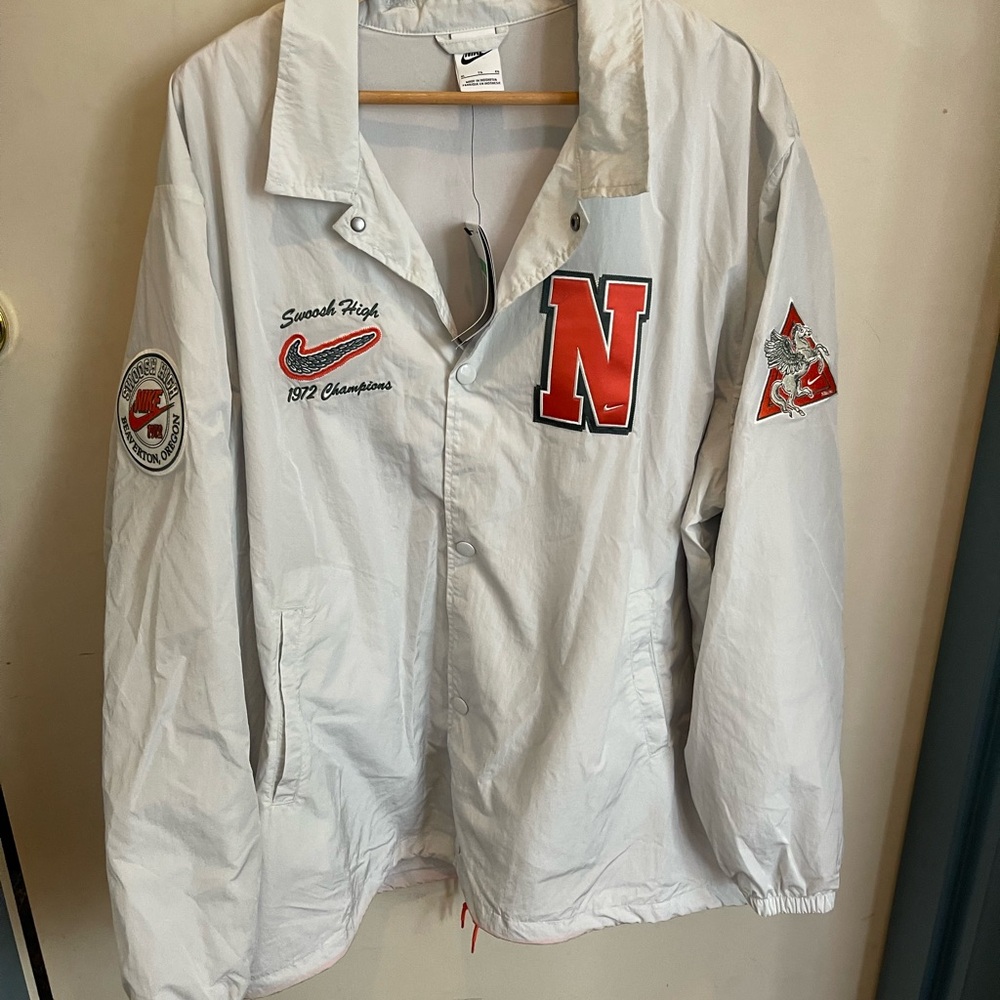 White Jacket with Green and Orange Lettering